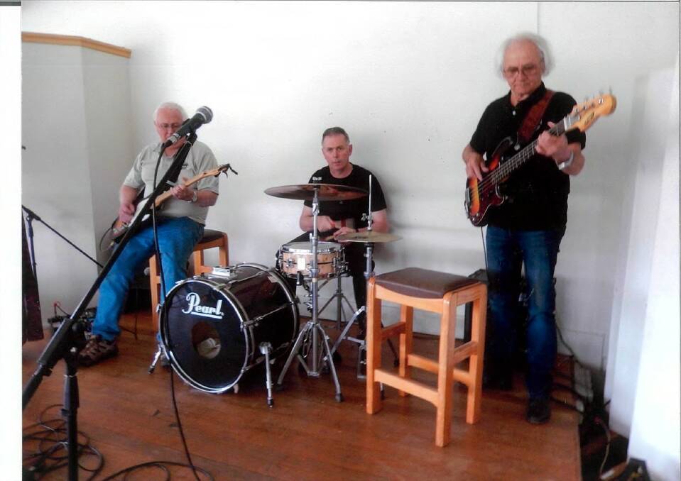 Grenfell drummer Dallas Munck jamming with Dave and Ray during the recent drought relief concert at Young Golf Club. (cont) 