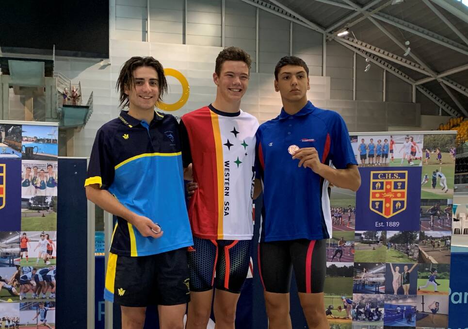 CHS CHAMPIONSHIPS: THLHS student Tom Robinson won gold in the 50-metre freestyle finals at the CHS championships. Tom (C) is pictured with silver medallist Jack Batson and bronze medallist Gabriel Giammarusti. 