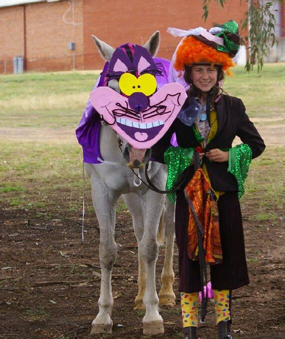 Lily Vardy was 'The Mad Hatter' with her 'Cheshire Cat'. Photo GPC