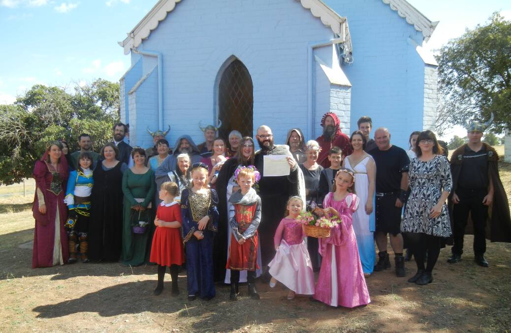 Wedding guests with the bride groom outside the "Little Blue Church". 