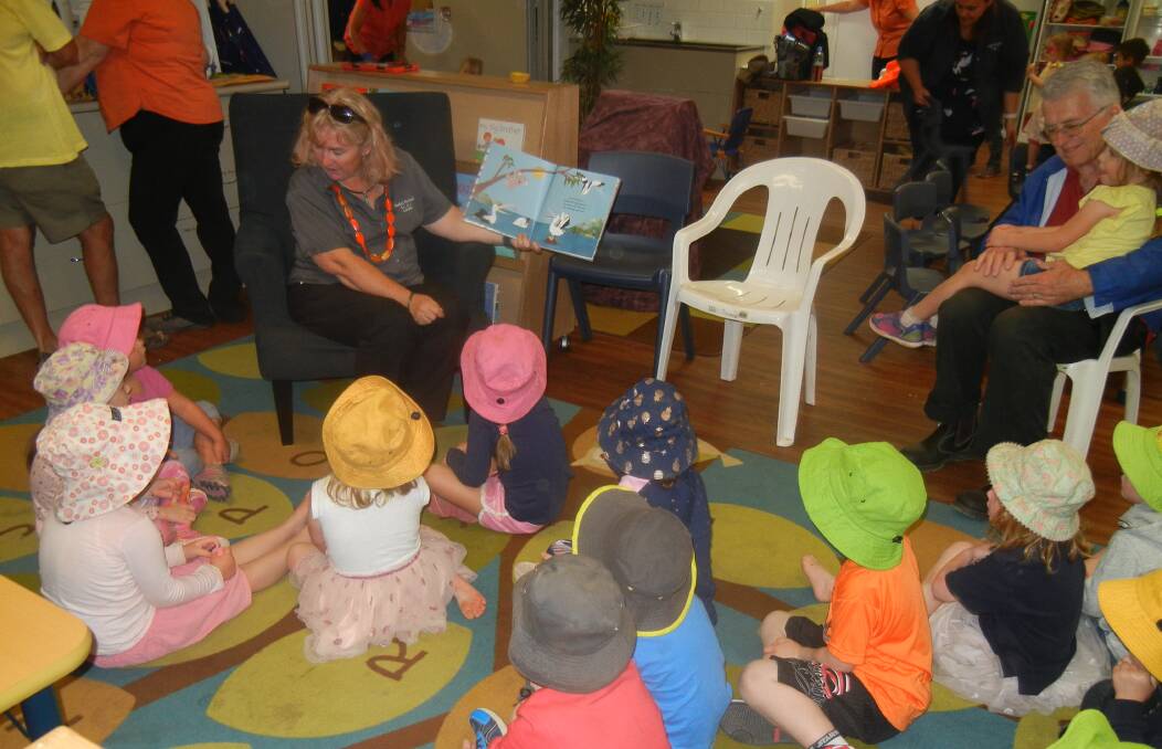 Pre-school students listening, learning and enjoying reading time.