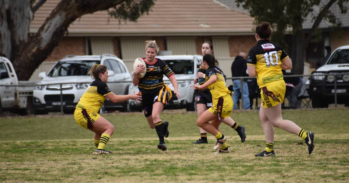 LEAGUE TAG: Girlanna Anna Brenner slips through the opposition at a recent game at Lawson Oval.