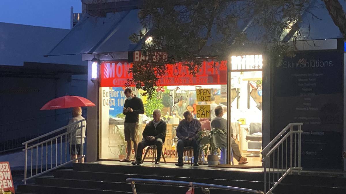 FREEDOM: Men were lining up outside a Sydney barber shop for a haircut at 6am on NSW 'Freedom Day', Monday, October 11.