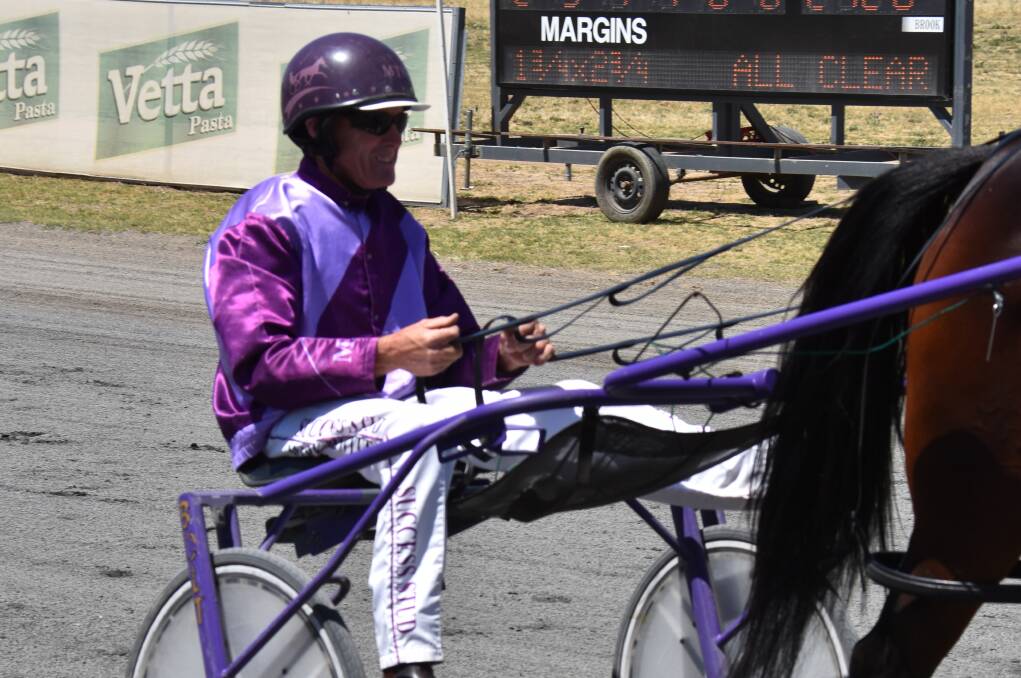 Grenfell harness racing trainer Mark Hewitt, pictured in the gig at Young Paceway last year, drove Mighty Joe to victory at Bathurst on Saturday. Photo: file