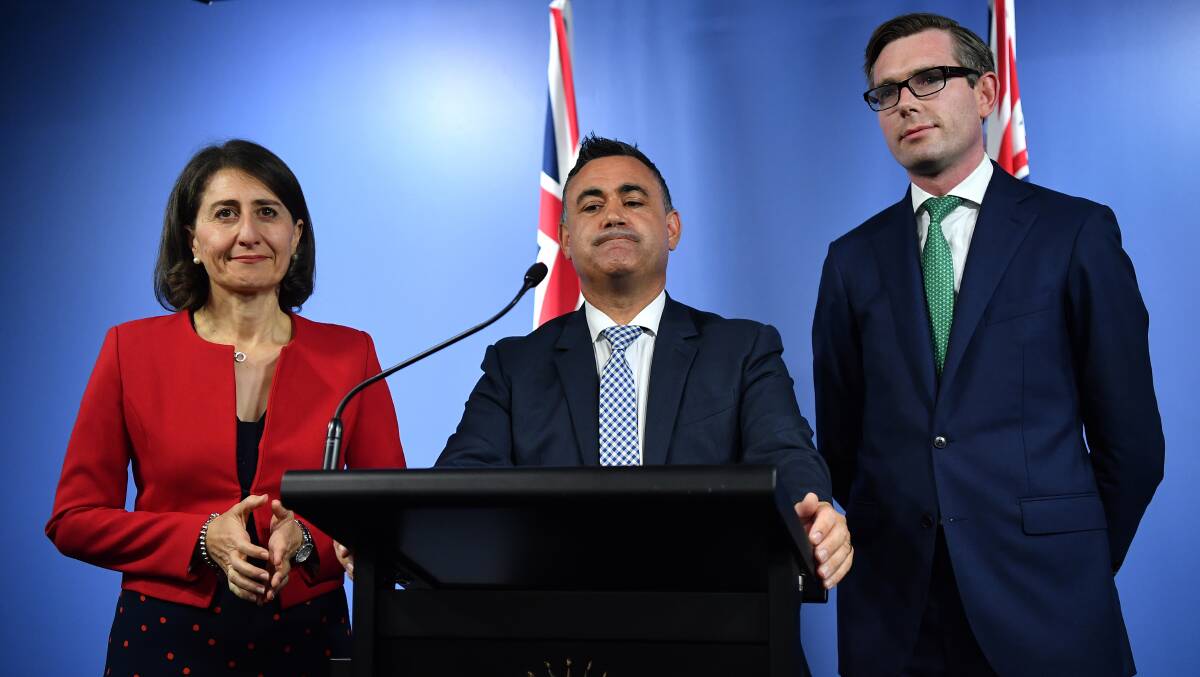 Deputy Premier John Barilaro, flanked by Premier Gladys Berejiklian and Treasurer Dominic Perrottet, said the Central West will get a good share of $4.1 billion for regional NSW. Photo: AAP Image/JOEL CARRETT