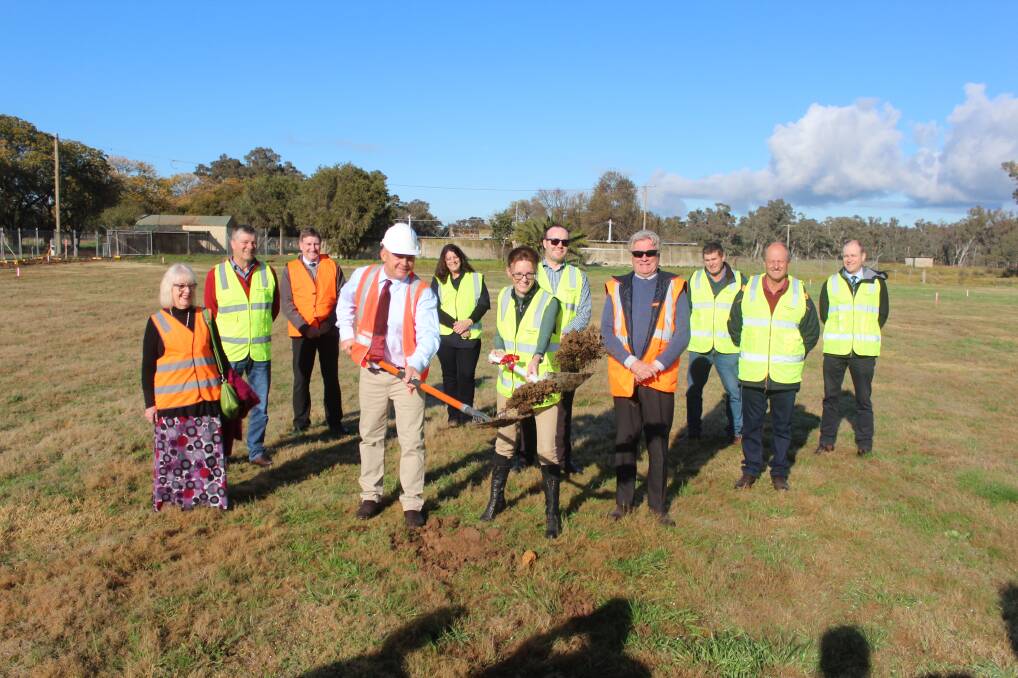 Mayor Mark Liebich and Member for Cootamundra Steph Cooke turning the first sod surrounded by Weddin Shire Councilors. 