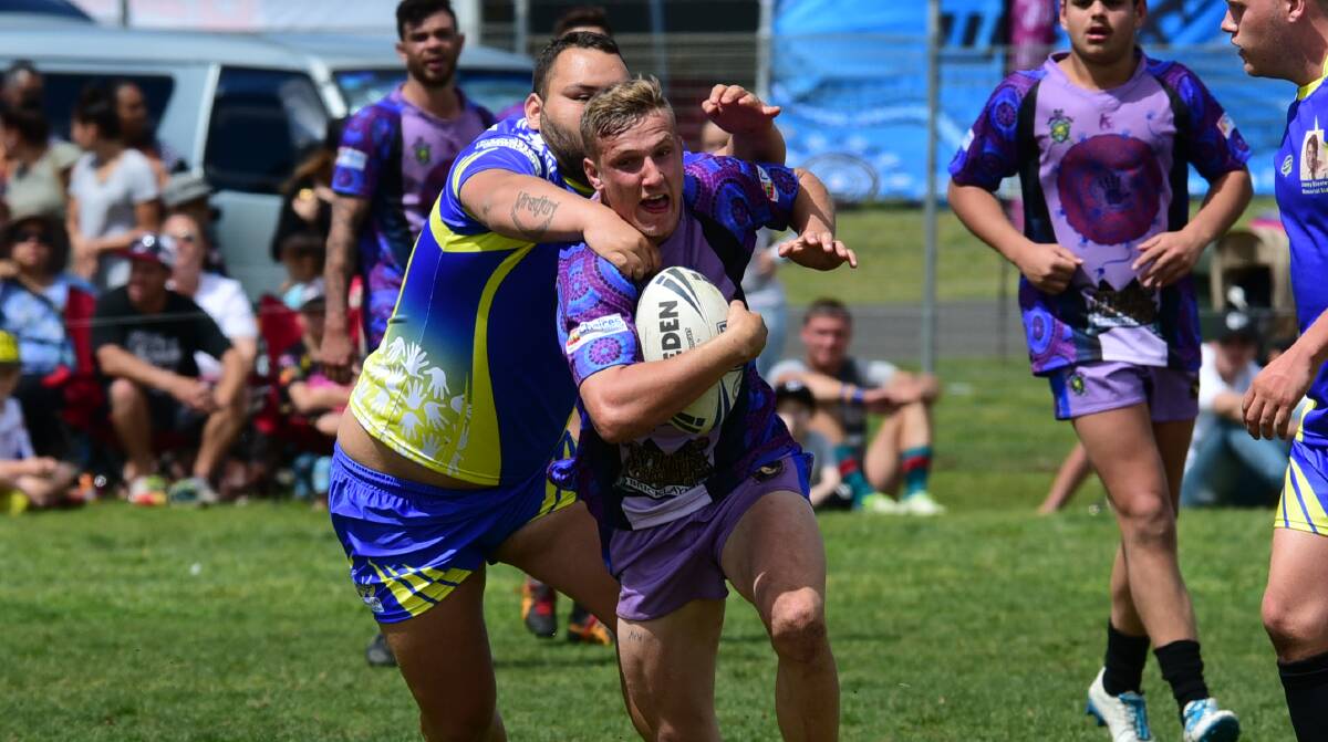 Busting run: Wade Kavanagh breaks through a tackle in his side's Knockout win. He was named player of the tournament. Photo: PAIGE WILLIAMS
