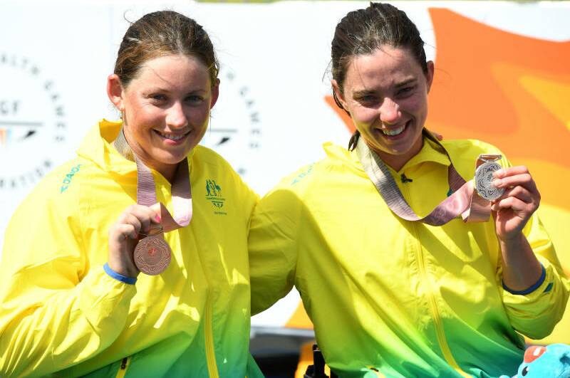 Bronze medalist Lauren Parker and silver medalist Emily Tapp of Australia during the medal ceremony for the women's PTWC Final on day three of the the XXI Commonwealth Games on the Gold Coast, Australia, Saturday, April 7, 2018. Picture: Dean Lewins