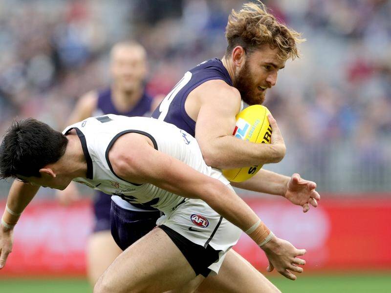 Connor Blakely (r) wants to re-sign for the Dockers and is hoping coach Ross Lyon stays with him.