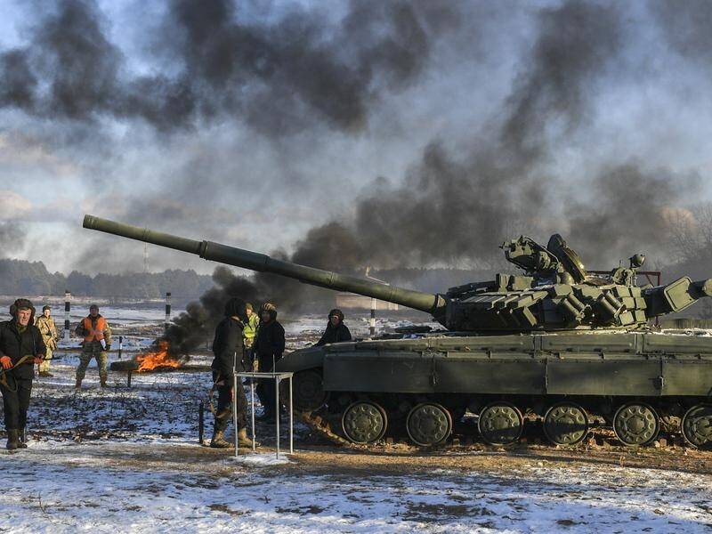 Ukraine's military has rehearsed repelling a tank and infantry attack near Russian-annexed Crimea.
