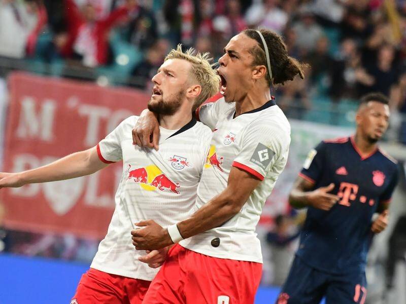 Emil Forsberg (l) hails his penalty-spot equaliser as Leipzig draw with Bayern Munich.