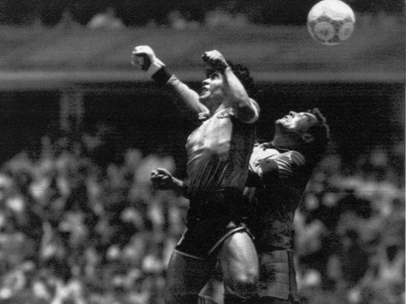 Diego Maradona scoring his legendary 'Hand of God' goal against England in the 1986 World Cup.
