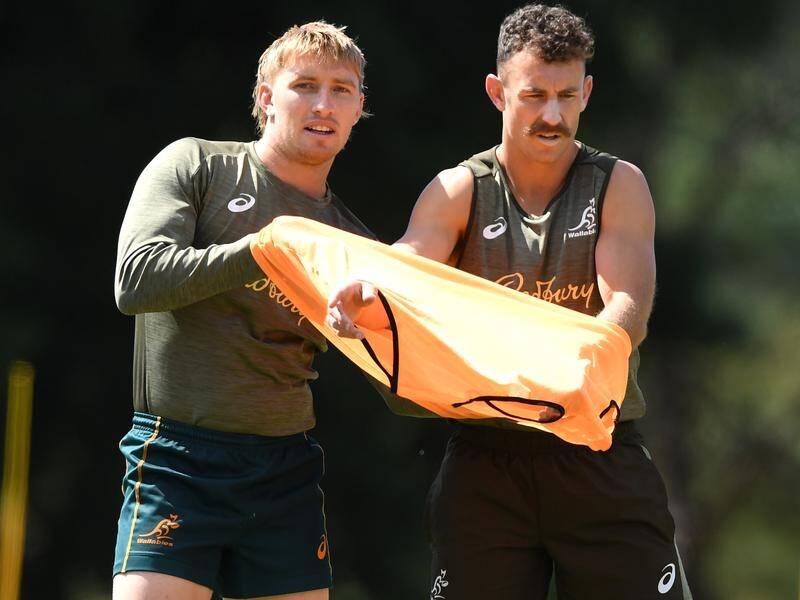 Nic White (r) has replaced Tate McDermott as Wallabies No.9 for the Test match against South Africa.