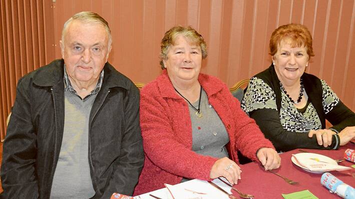 At the Christmas In July at the Bowlies dinner last Saturday evening were Rod and Kay McLelland with Jackie Ryan. 