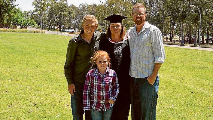 Leesa McCue who graduated from Charles Sturt University last December after completing a Bachelor of Health Science (Leisure and Health) is pictured here with her family - husband Jason, son Joshua and daughter Katie. (Photo contributed) 