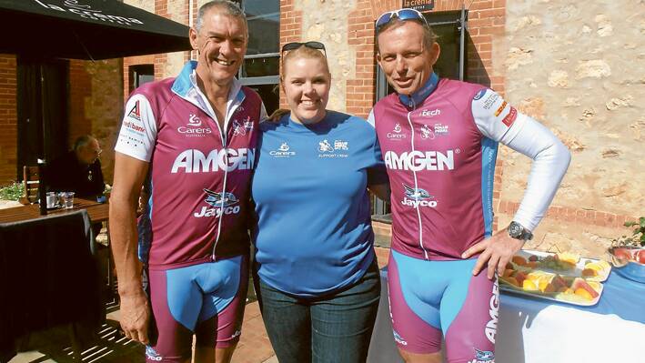 Former Grenfell resident Wayne Heathcote with his daughter Sarah (a ride volunteer) and the Prime Minister Tony Abbott on the Pollie Pedal Ride last year. (Photo contributed) 