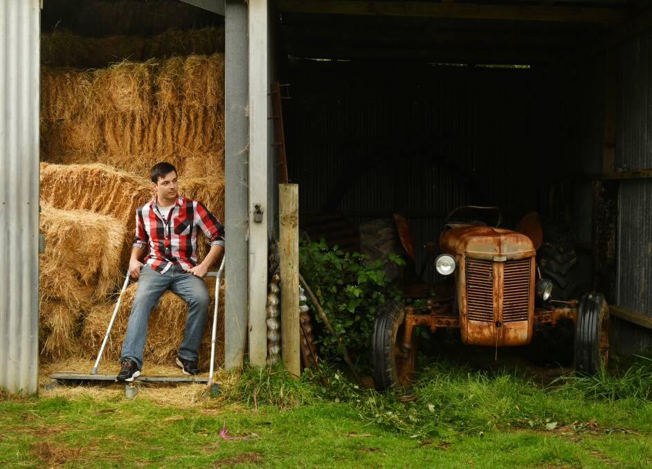 FRIEND OR FOE: Tim Silverton with the 1950s Massey Ferguson tractor that almost claimed his life in an accident in February. Picture: Brodie Weeding