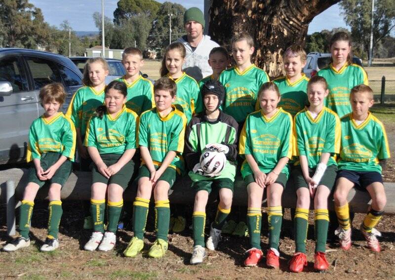 The Mitton Brothers Earthmoving under 12's team is - Coach Brent Cartwright. Back row from L to R - Hannah Cartwright, Andrew Knight, Abbey Joyce, Zoe Gavin, Ebony Meier, Sophie Bucknell and Jessica Pereira Front row L to R - Ethan Eyles, Heather Walter, Connor Day, Mathew Whatman, Holly Bucknell, Rebecca Glanville and Kevin Silburn. 