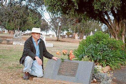 Author Peter Bradley next to a restored mass grave of some of Hall’s contemporaries and where he claims Ben Hall could actually be buried himself. 
