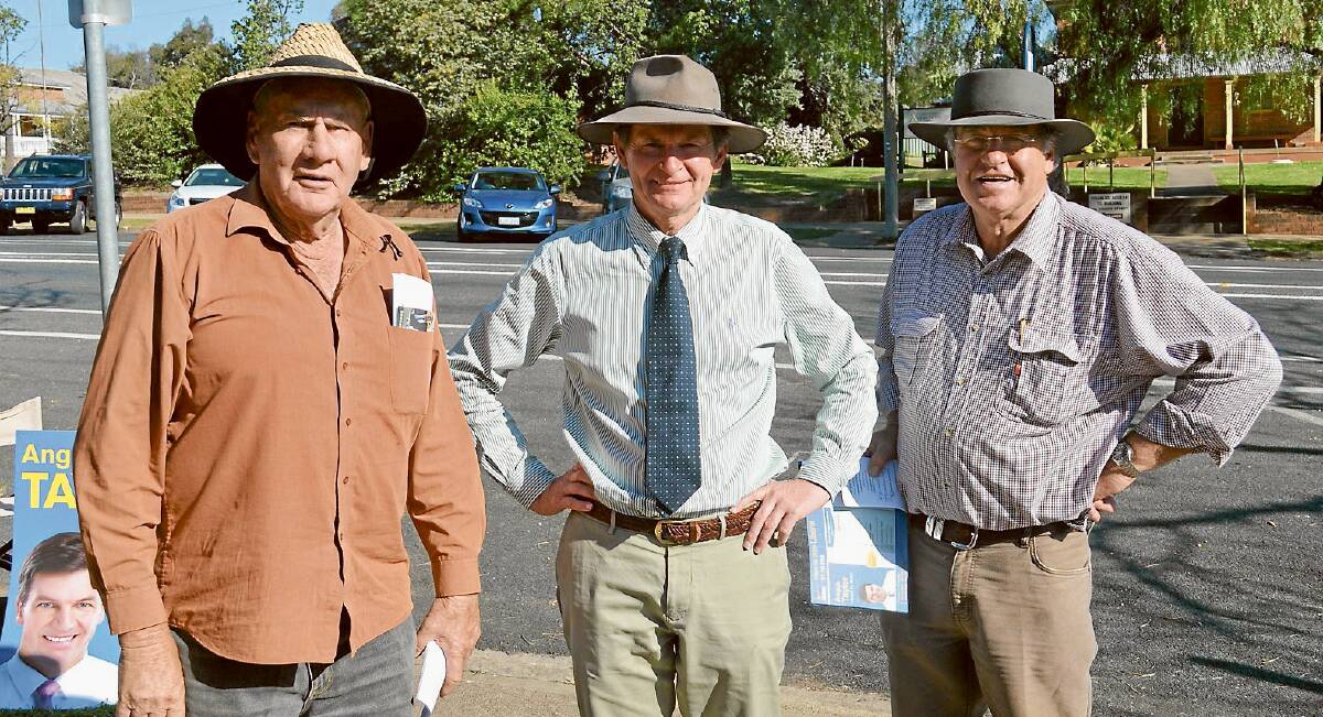 Having a good old chat outside the Grenfell polling booth at the Uniting Church hall on Saturday were coalition polling booth pamphleteers Mo Simpson (l) and Harvey Matthews (r) and Independent candidate for Hume James Harker-Mortlock (c).